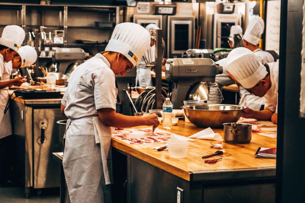 Chefs practice their skills in post-secondary programs that prepare them for the food and beverage industry.